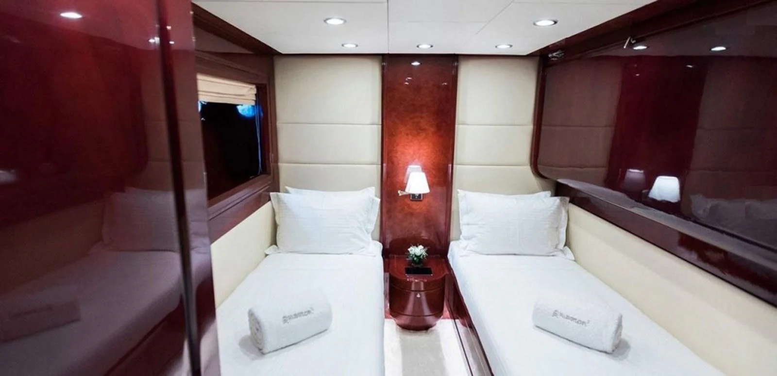 a room with beds and a table aboard ALBATOR 2 Yacht for Sale