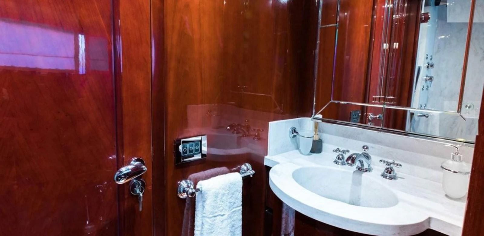 a bathroom with a sink and a mirror aboard ALBATOR 2 Yacht for Sale