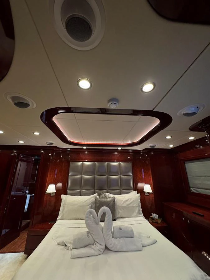 a room with a bed and a mirror aboard ALBATOR 2 Yacht for Sale