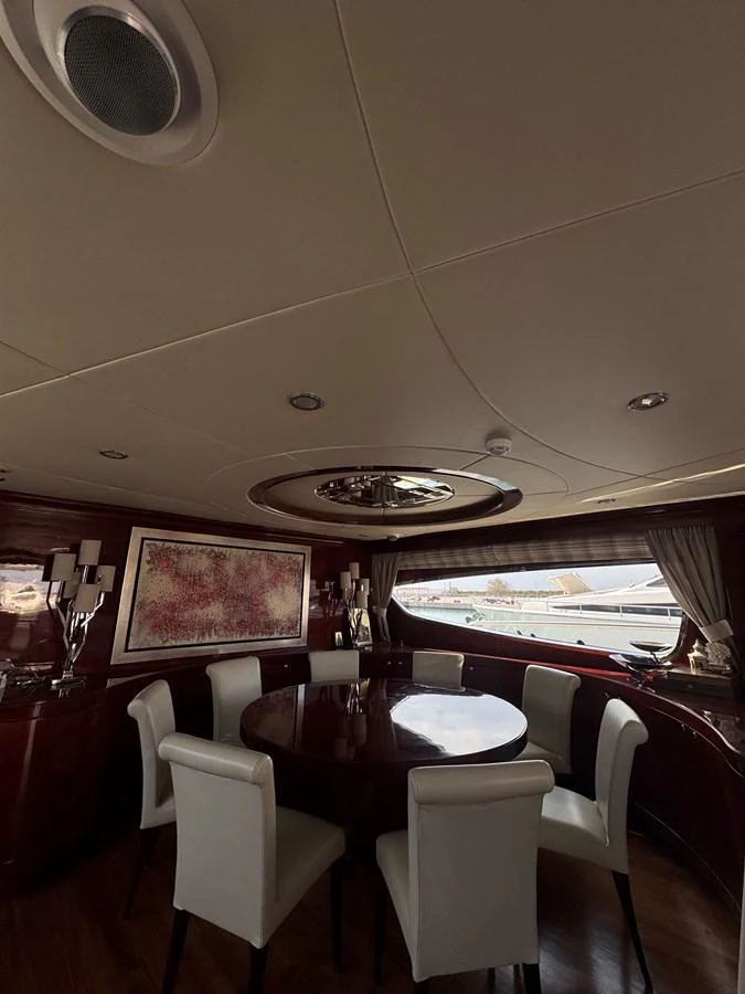a dining room with a table and chairs aboard ALBATOR 2 Yacht for Sale