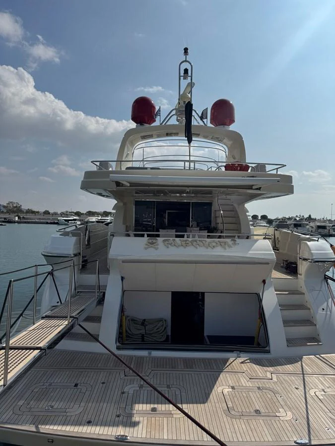 a white and black boat on a dock aboard ALBATOR 2 Yacht for Sale