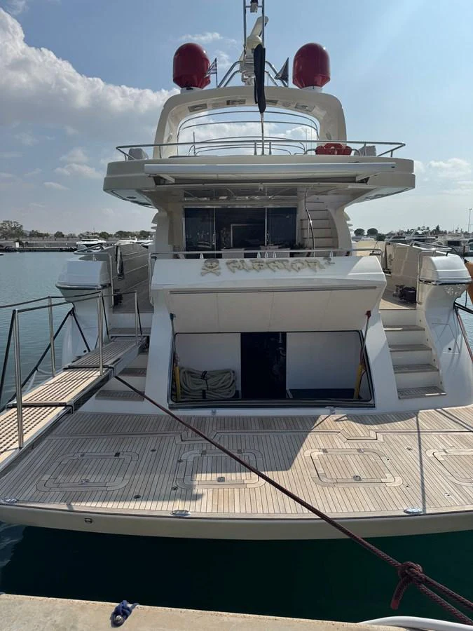 a large white boat with a red and white balloon tied to it aboard ALBATOR 2 Yacht for Sale