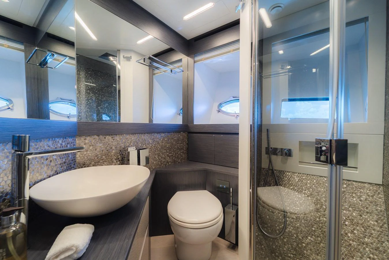 The yacht's bathroom features modern fixtures and a sleek design. aboard NOVA Yacht for Sale