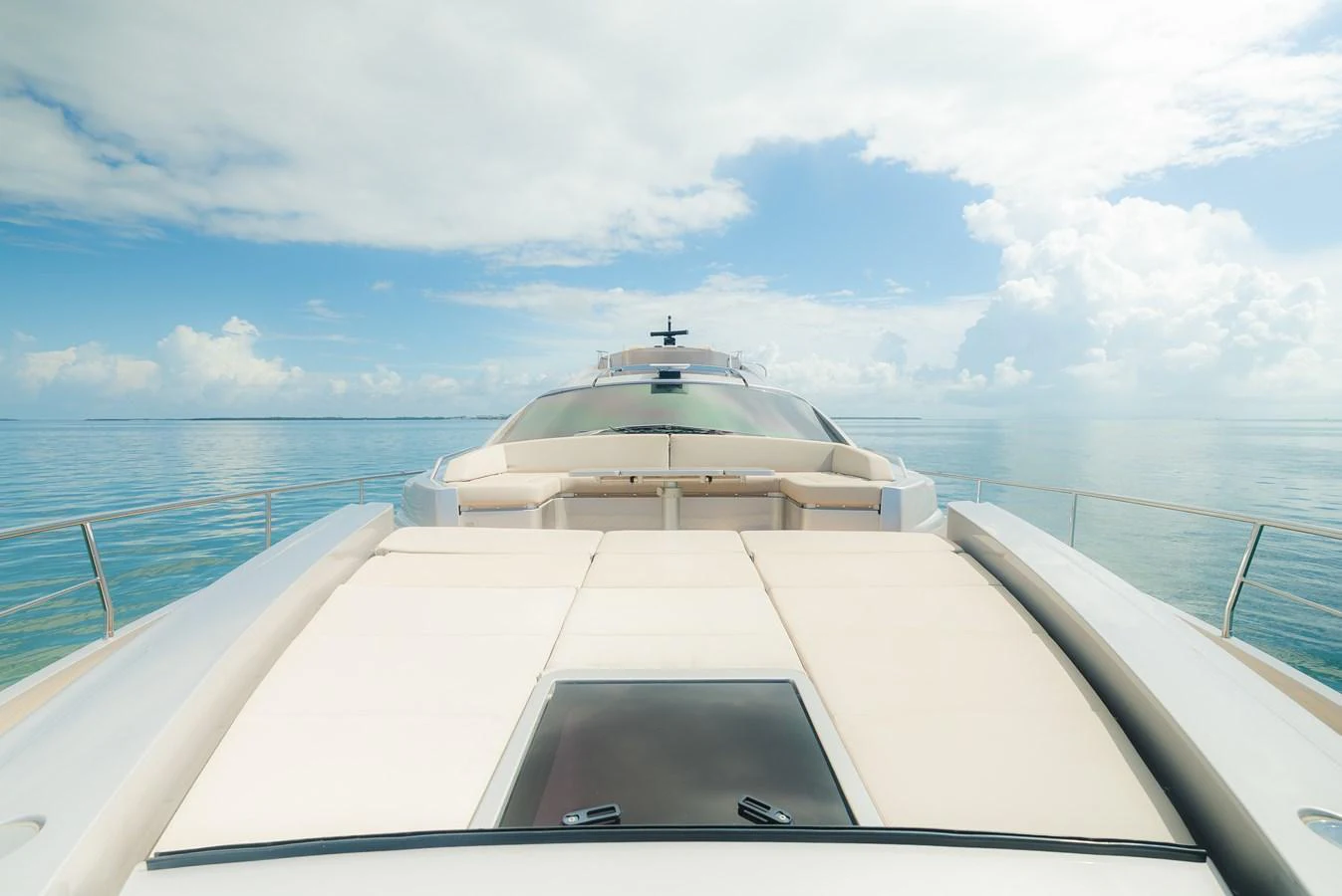 The yacht's foredeck offers a spacious sunbathing area with stunning ocean views. aboard NOVA Yacht for Sale