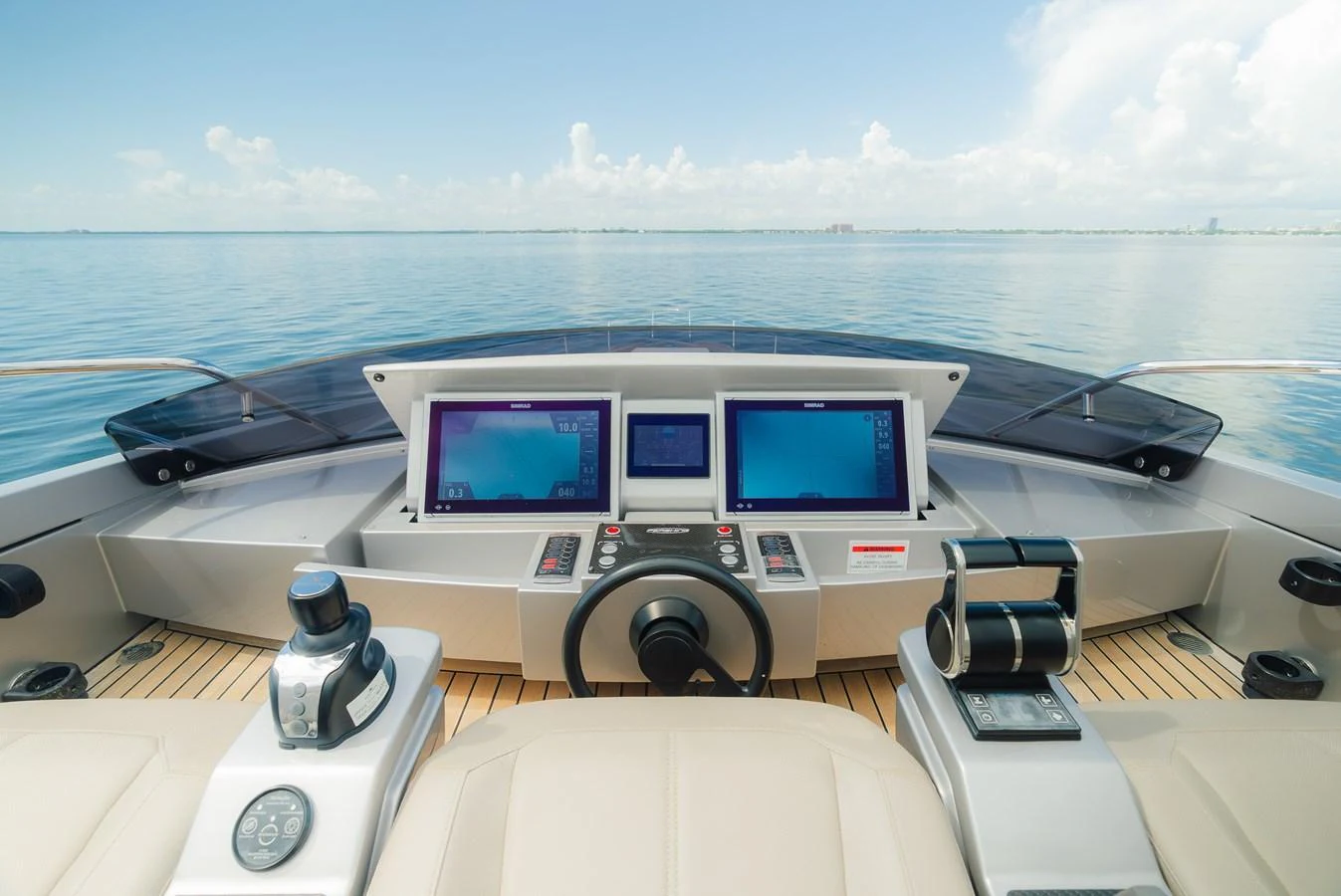 The helm station features state-of-the-art navigation equipment and a panoramic view of the open sea. aboard NOVA Yacht for Sale