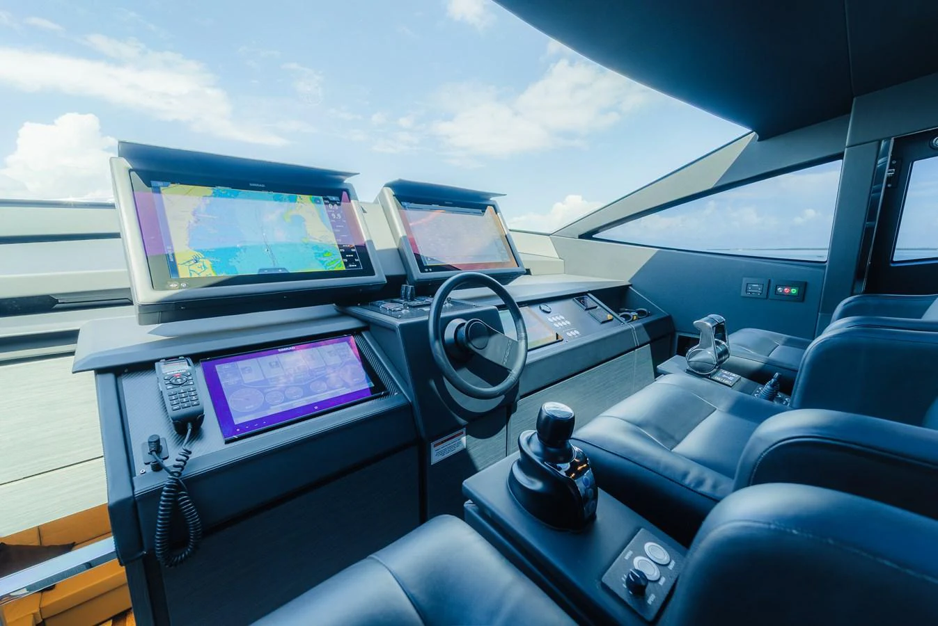 The helm station features advanced navigation equipment and luxurious seating, offering a commanding view for the captain. aboard NOVA Yacht for Sale