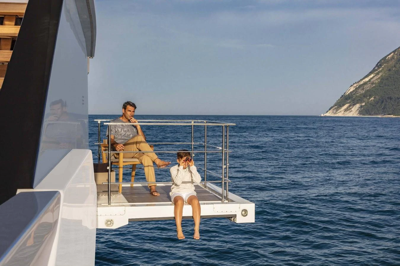 A serene balcony on the yacht offers a perfect spot to relax and enjoy the ocean view. aboard CUSTOM LINE SAETTA 128/02 Yacht for Sale