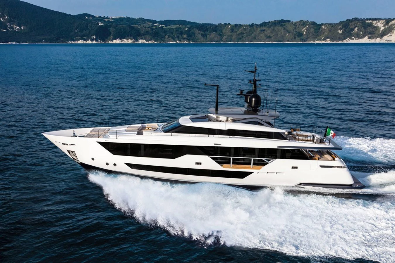 A sleek and modern yacht cruises swiftly through the open water, showcasing its elegant design. aboard CUSTOM LINE SAETTA 128/02 Yacht for Sale