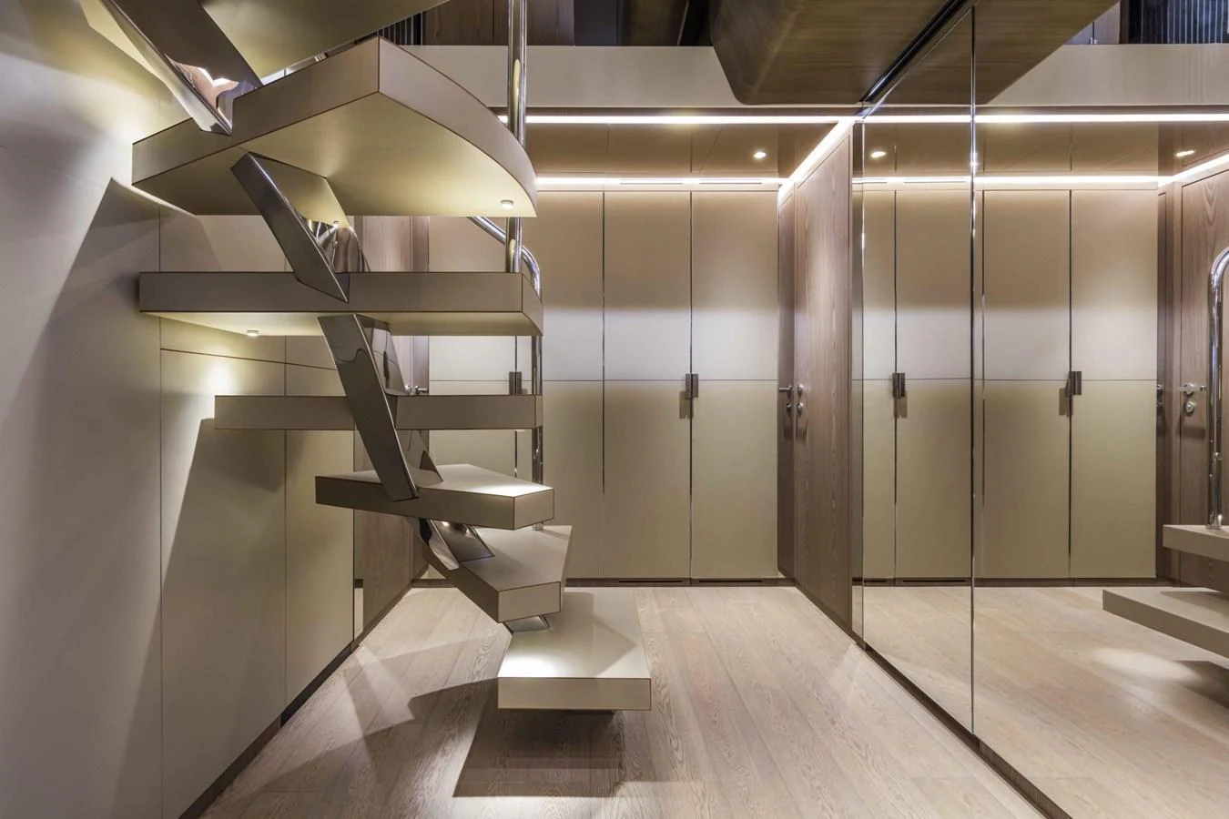 The yacht's interior features a modern staircase with sleek, contemporary design elements. aboard CUSTOM LINE SAETTA 128/02 Yacht for Sale