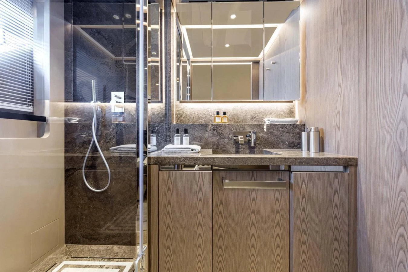 The yacht's bathroom features modern fixtures and elegant finishes. aboard CUSTOM LINE SAETTA 128/02 Yacht for Sale