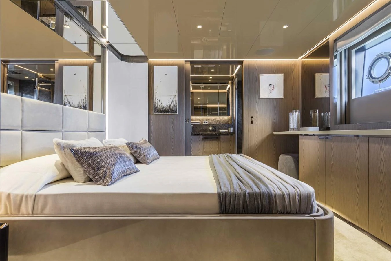 The stateroom features a luxurious bed with elegant decor and ample natural light. aboard CUSTOM LINE SAETTA 128/02 Yacht for Sale