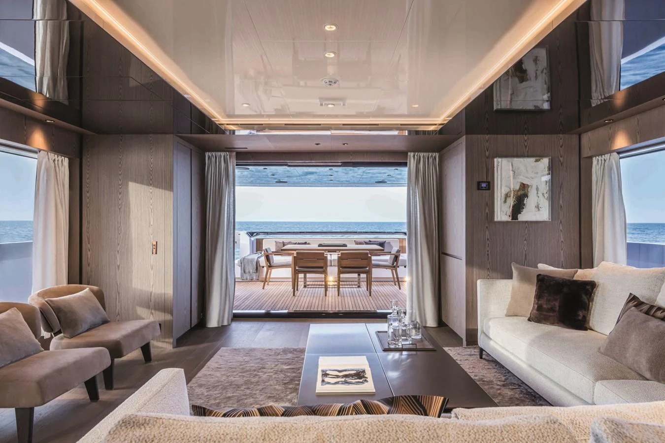 The salon offers a luxurious and spacious area with a seamless transition to the aft deck, perfect for relaxation and entertainment. aboard CUSTOM LINE SAETTA 128/02 Yacht for Sale