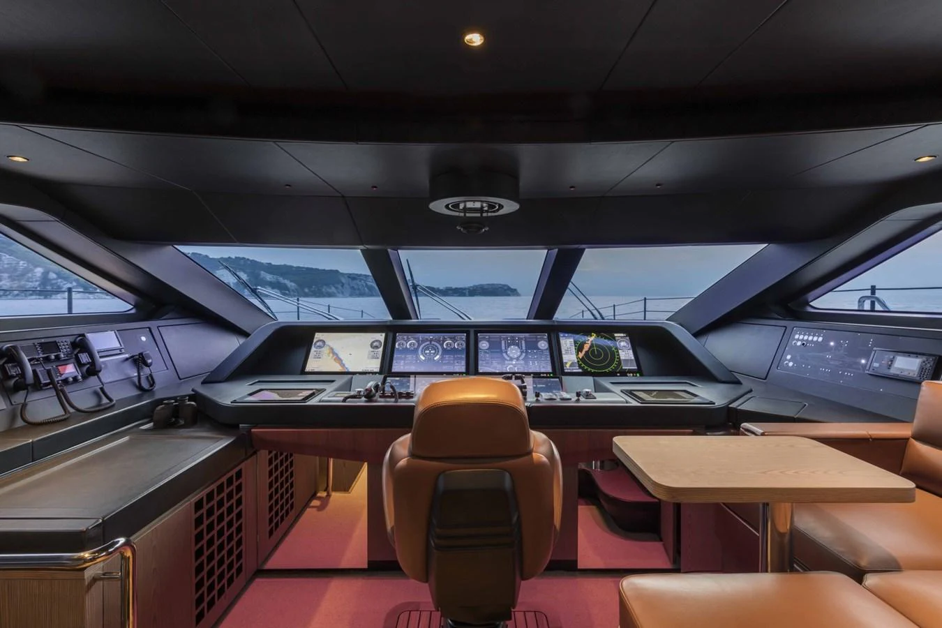 The helm station offers a sophisticated and commanding view with state-of-the-art navigation equipment. aboard CUSTOM LINE SAETTA 128/02 Yacht for Sale