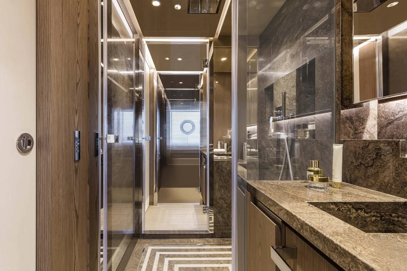 The yacht's bathroom features luxurious finishes with marble countertops and modern fixtures. aboard CUSTOM LINE SAETTA 128/02 Yacht for Sale
