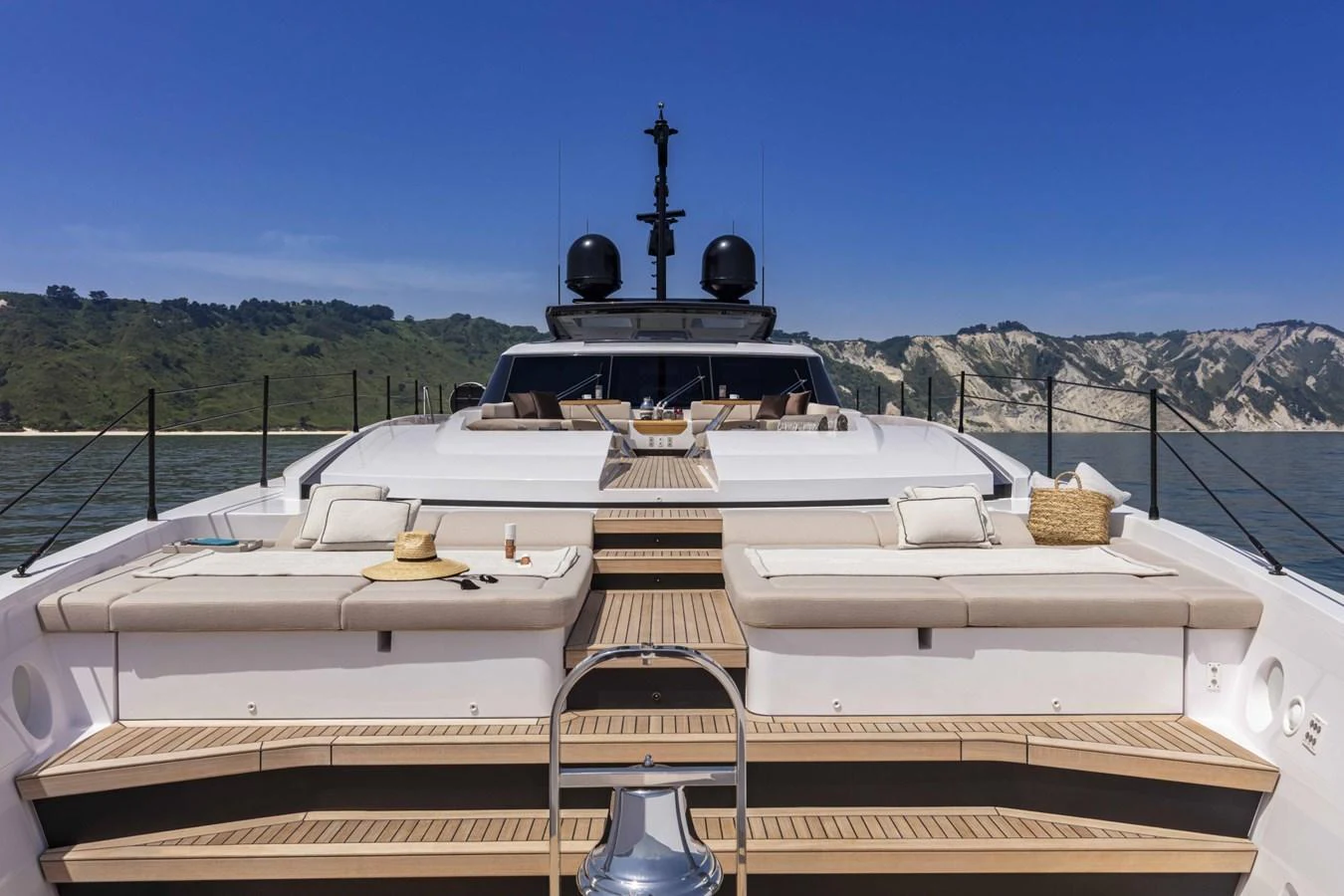 The sundeck offers luxurious lounging with plush sunbeds and scenic views. aboard CUSTOM LINE SAETTA 128/02 Yacht for Sale