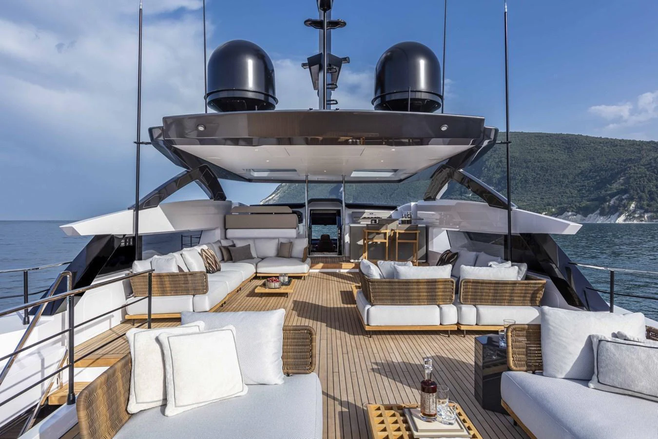 The spacious flybridge offers luxurious seating and stunning views, perfect for relaxation and entertainment. aboard CUSTOM LINE SAETTA 128/02 Yacht for Sale