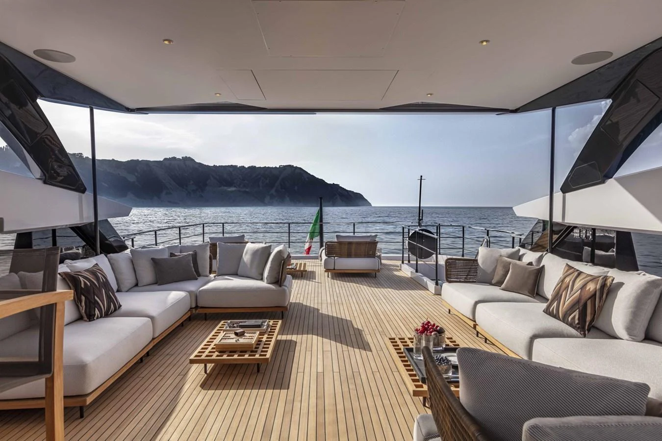 The spacious aft deck offers luxurious seating with stunning ocean views. aboard CUSTOM LINE SAETTA 128/02 Yacht for Sale