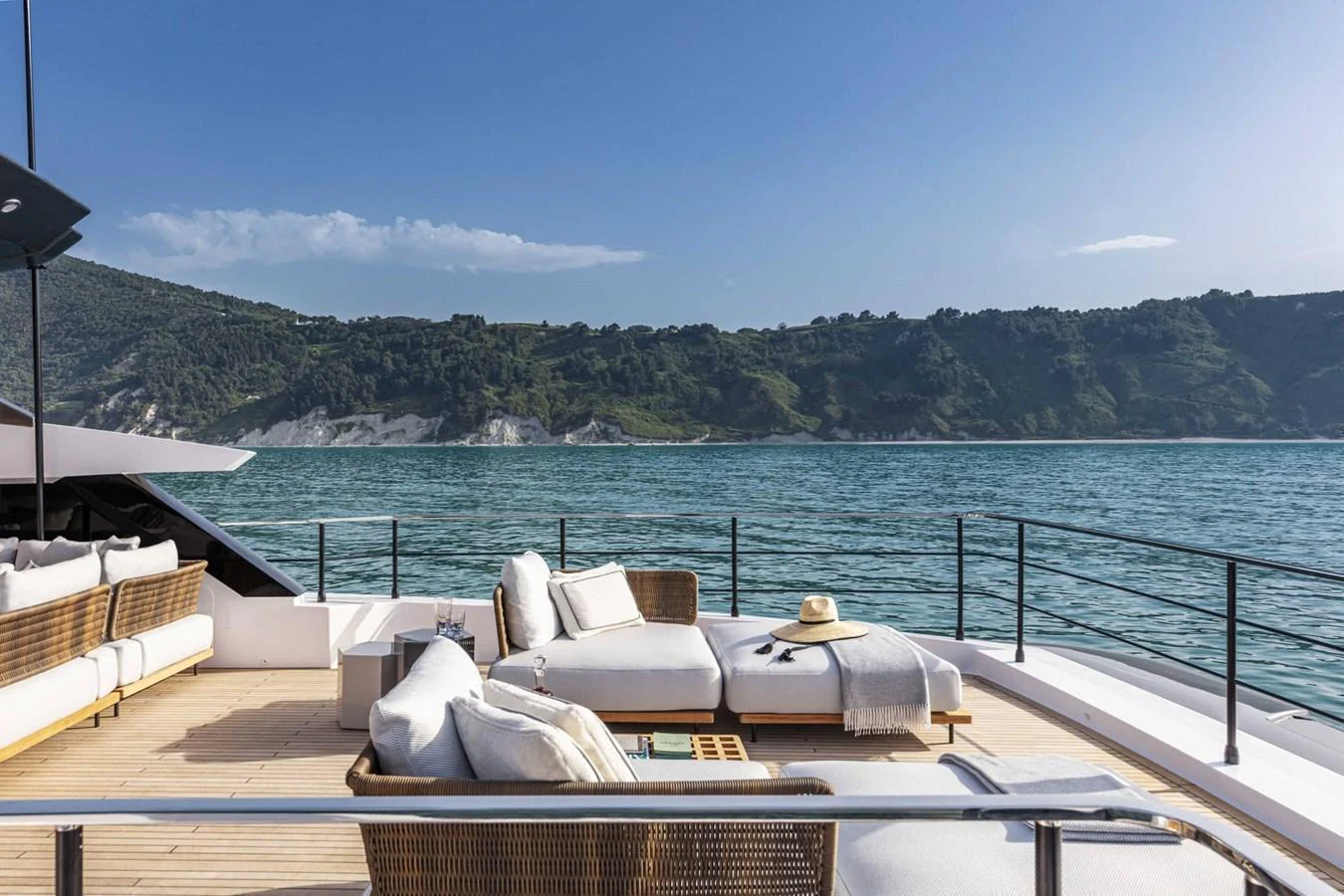 The sundeck offers a luxurious lounging area with comfortable seating and stunning views of the surrounding waters. aboard CUSTOM LINE SAETTA 128/02 Yacht for Sale