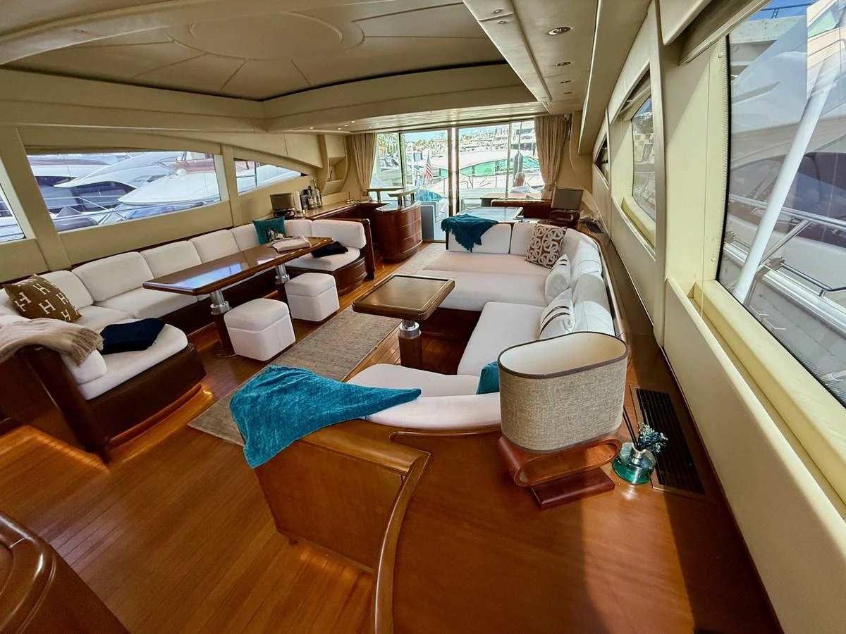 a living room with a large window aboard OLIVIA K Yacht for Sale