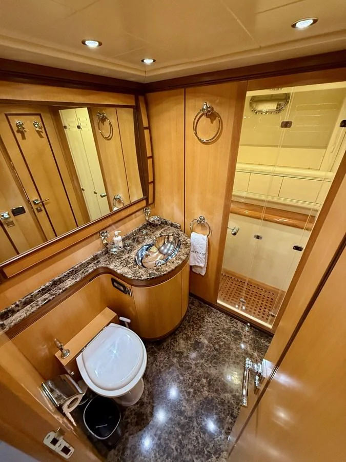 a bathroom with a large mirror aboard OLIVIA K Yacht for Sale