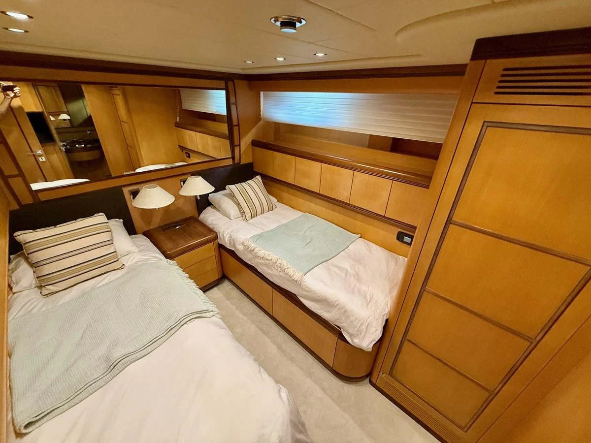 a room with two beds aboard OLIVIA K Yacht for Sale