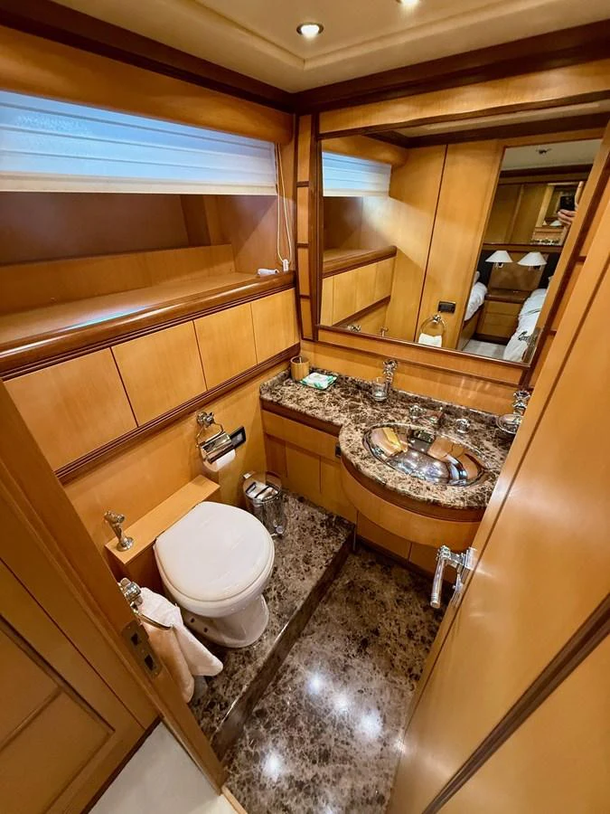 a bathroom with a sink and a toilet aboard OLIVIA K Yacht for Sale