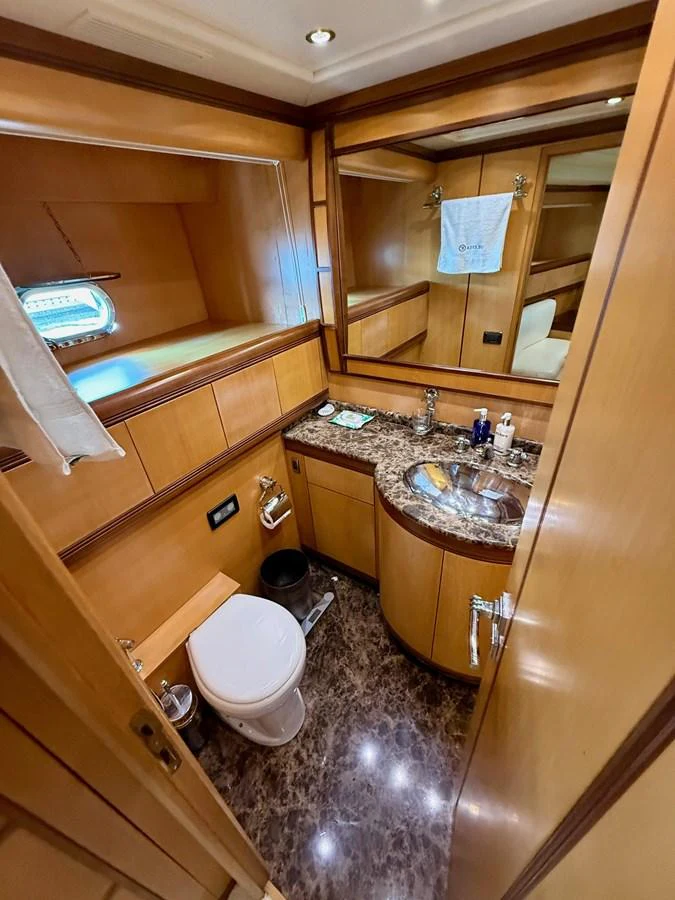 a bathroom with a sink and a mirror aboard OLIVIA K Yacht for Sale