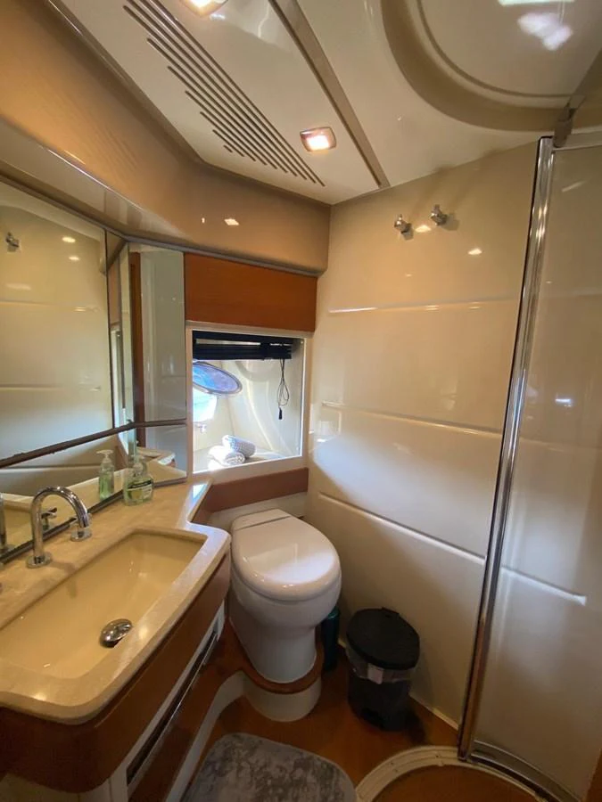 a bathroom with a toilet and sink aboard DREN Yacht for Sale