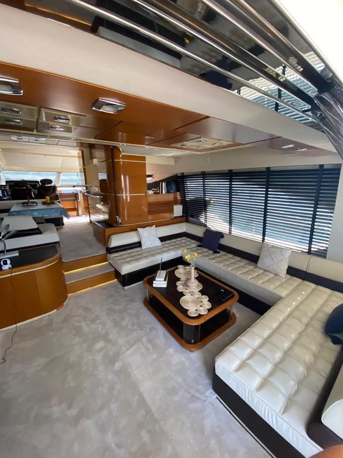 a room with a couch and a coffee table aboard DREN Yacht for Sale