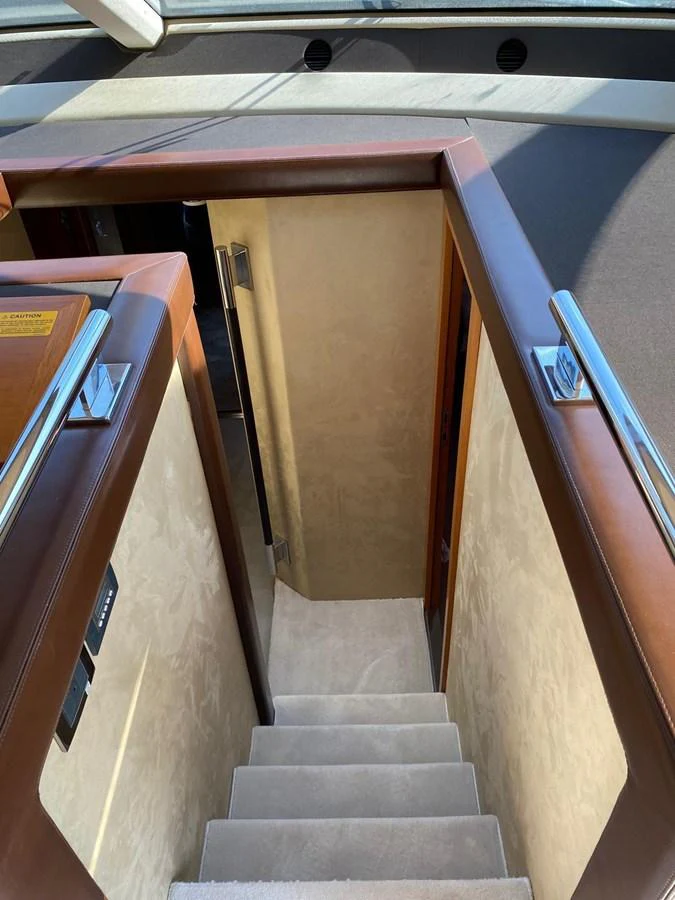 a wooden staircase with a wood paneled wall aboard DREN Yacht for Sale