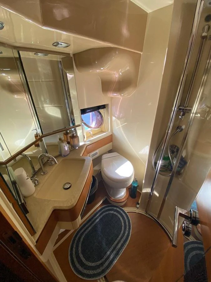 a bathroom with a large mirror aboard DREN Yacht for Sale