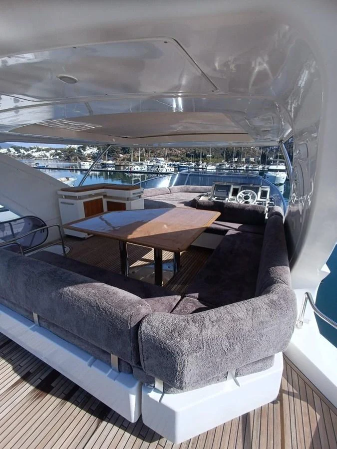 a couch and table in a room aboard DREN Yacht for Sale