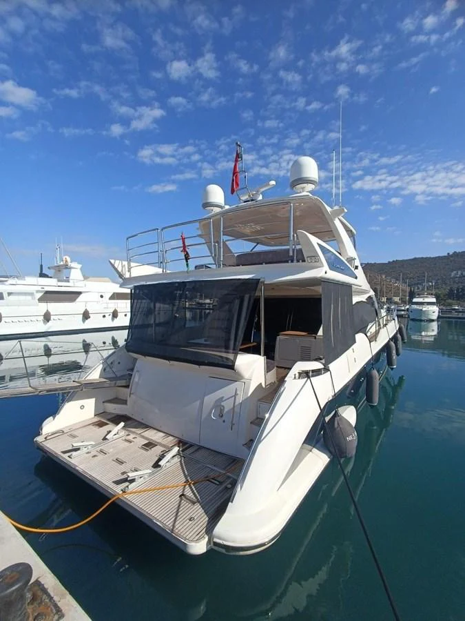 a boat docked at a pier aboard DREN Yacht for Sale