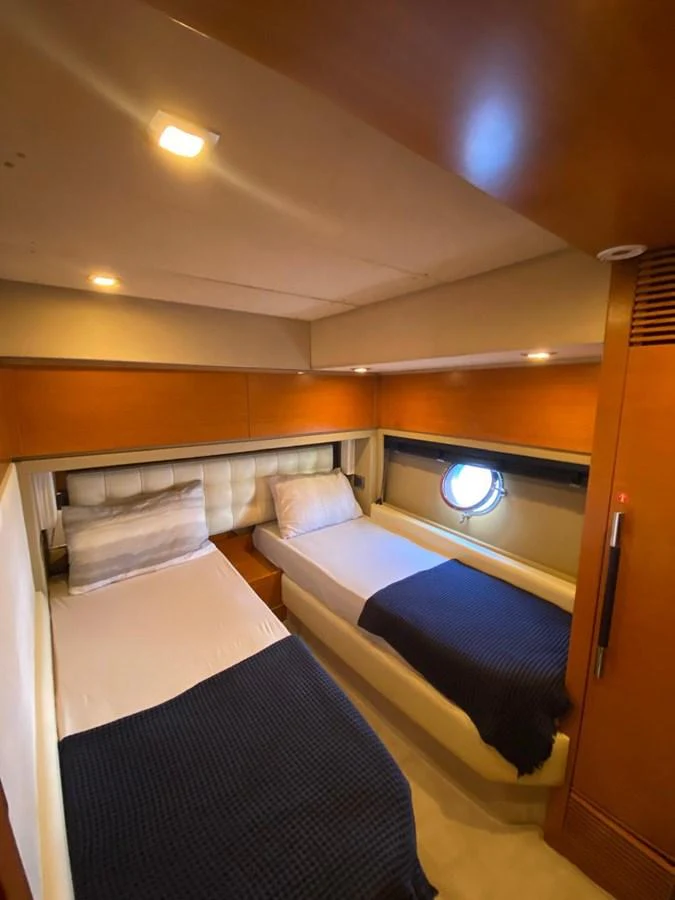 a room with a bed and a window aboard DREN Yacht for Sale
