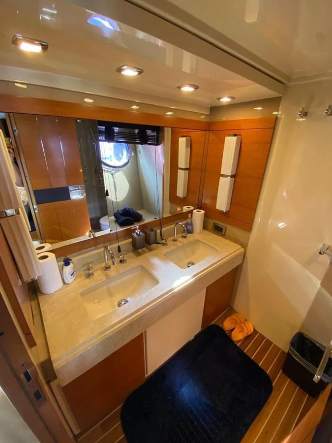 a bathroom with a large mirror aboard DREN Yacht for Sale