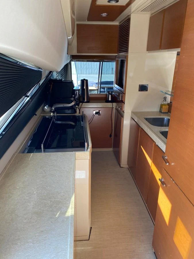 a kitchen with a sink and cabinets aboard DREN Yacht for Sale