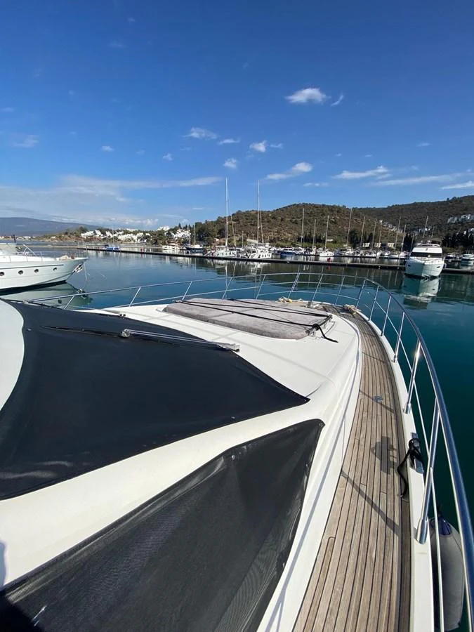 a boat is parked in a harbor aboard DREN Yacht for Sale