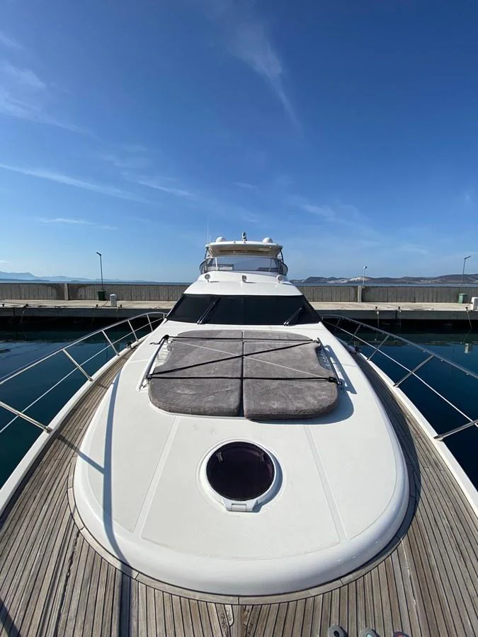 a large white ship on a deck aboard DREN Yacht for Sale