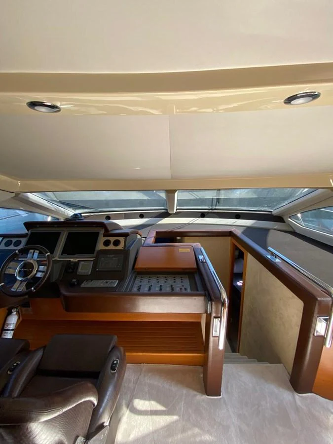 a wooden desk with a computer on it aboard DREN Yacht for Sale