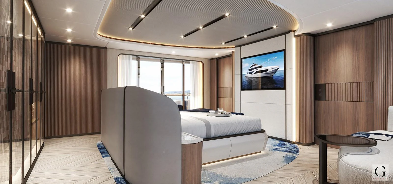 The master stateroom features a luxurious bed, modern decor, and a large screen TV. aboard MAJESTY 145 Yacht for Sale