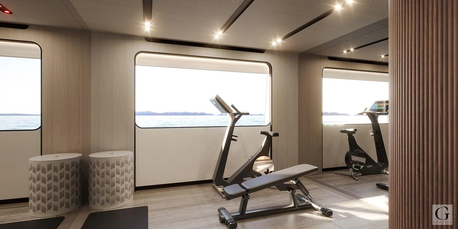 The yacht's gym offers a serene workout space with stunning sea views. aboard MAJESTY 145 Yacht for Sale