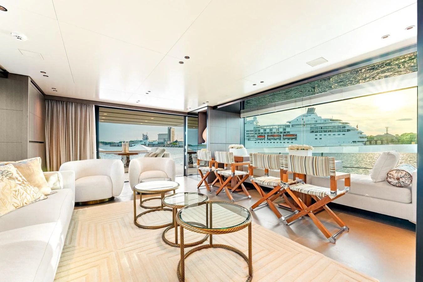 a living room with a large window aboard NORTH Yacht for Sale