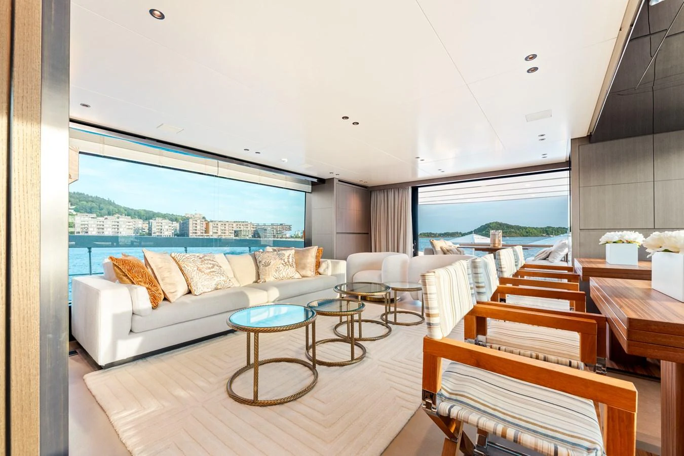 a living room with a large window aboard NORTH Yacht for Sale