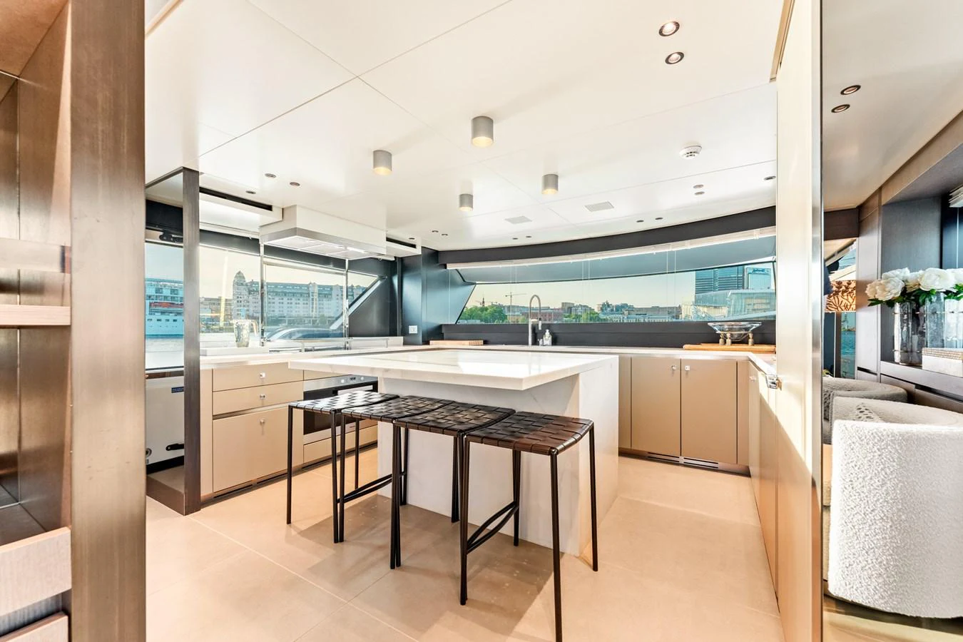 a kitchen with a table and chairs aboard NORTH Yacht for Sale