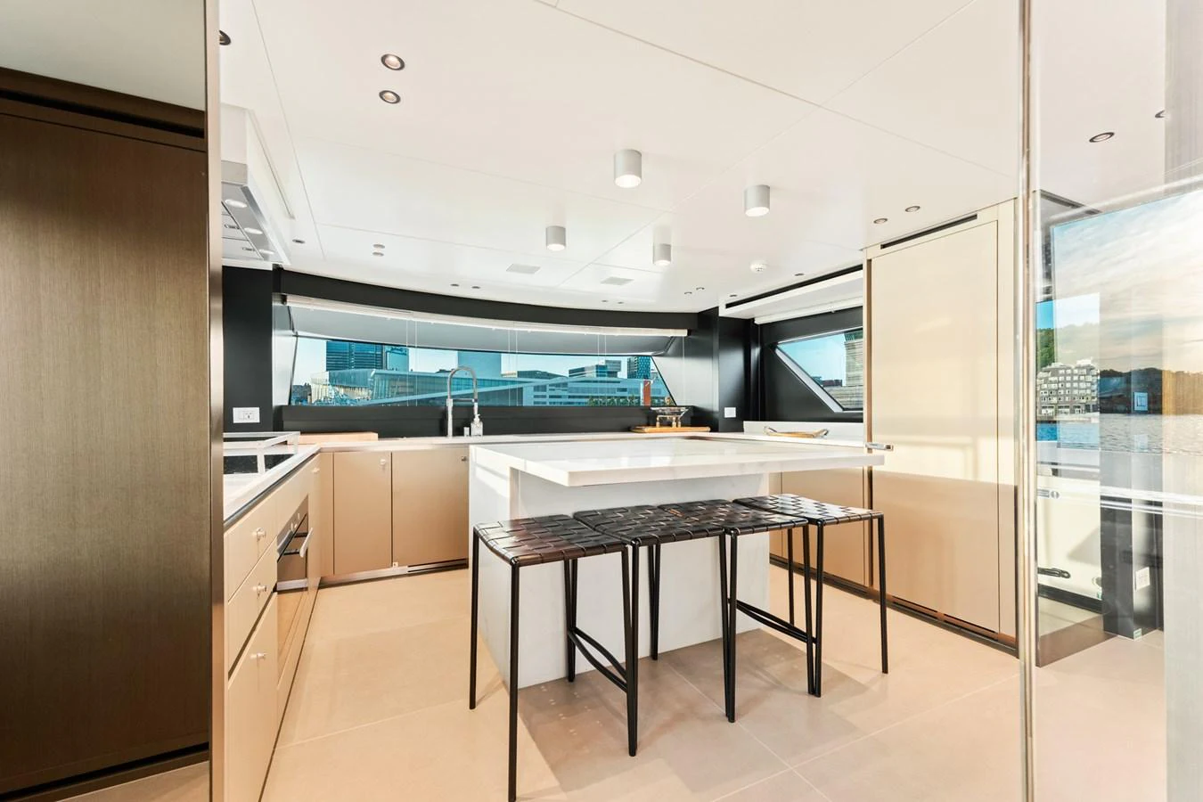 a kitchen with a table and refrigerator aboard NORTH Yacht for Sale