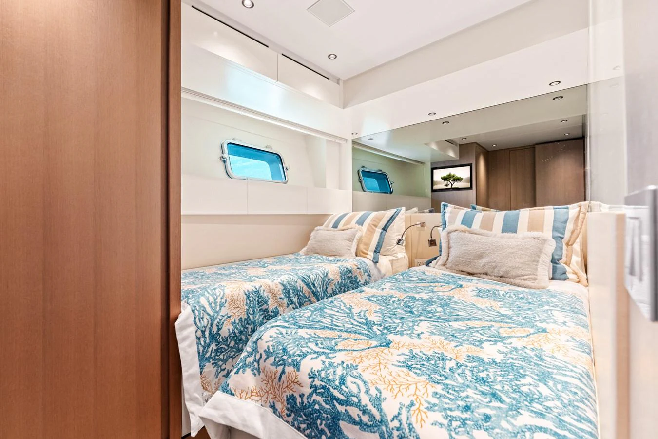 a bed with blue sheets aboard NORTH Yacht for Sale