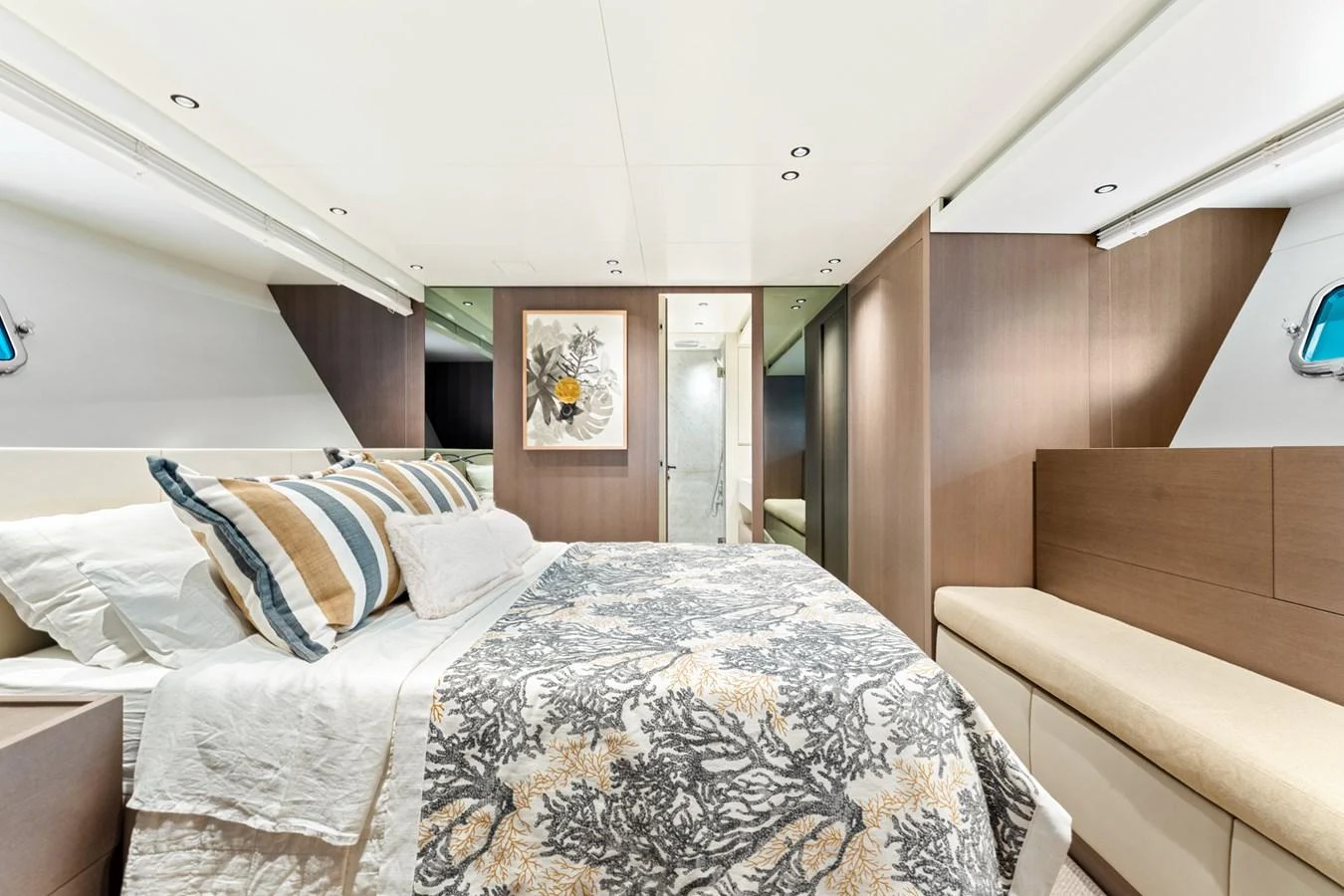 a bed with a white comforter aboard NORTH Yacht for Sale