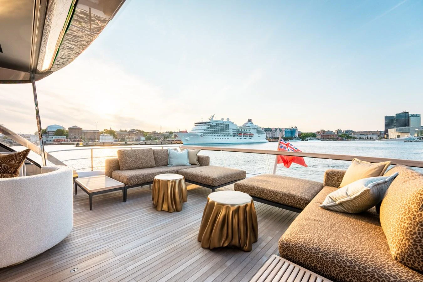 a patio with couches and a view of a city aboard NORTH Yacht for Sale