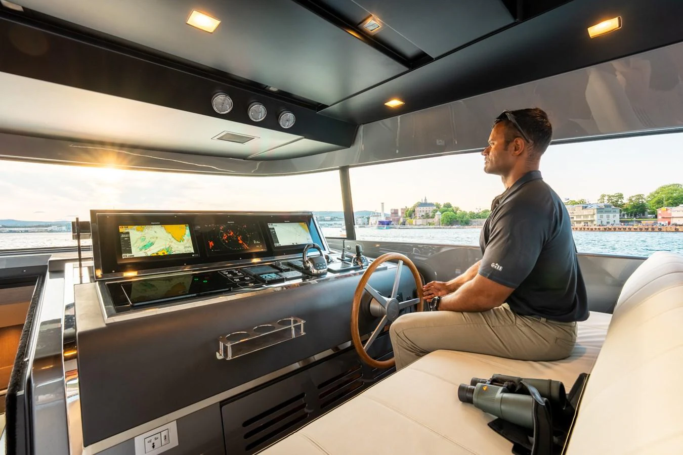 a person driving a car aboard NORTH Yacht for Sale