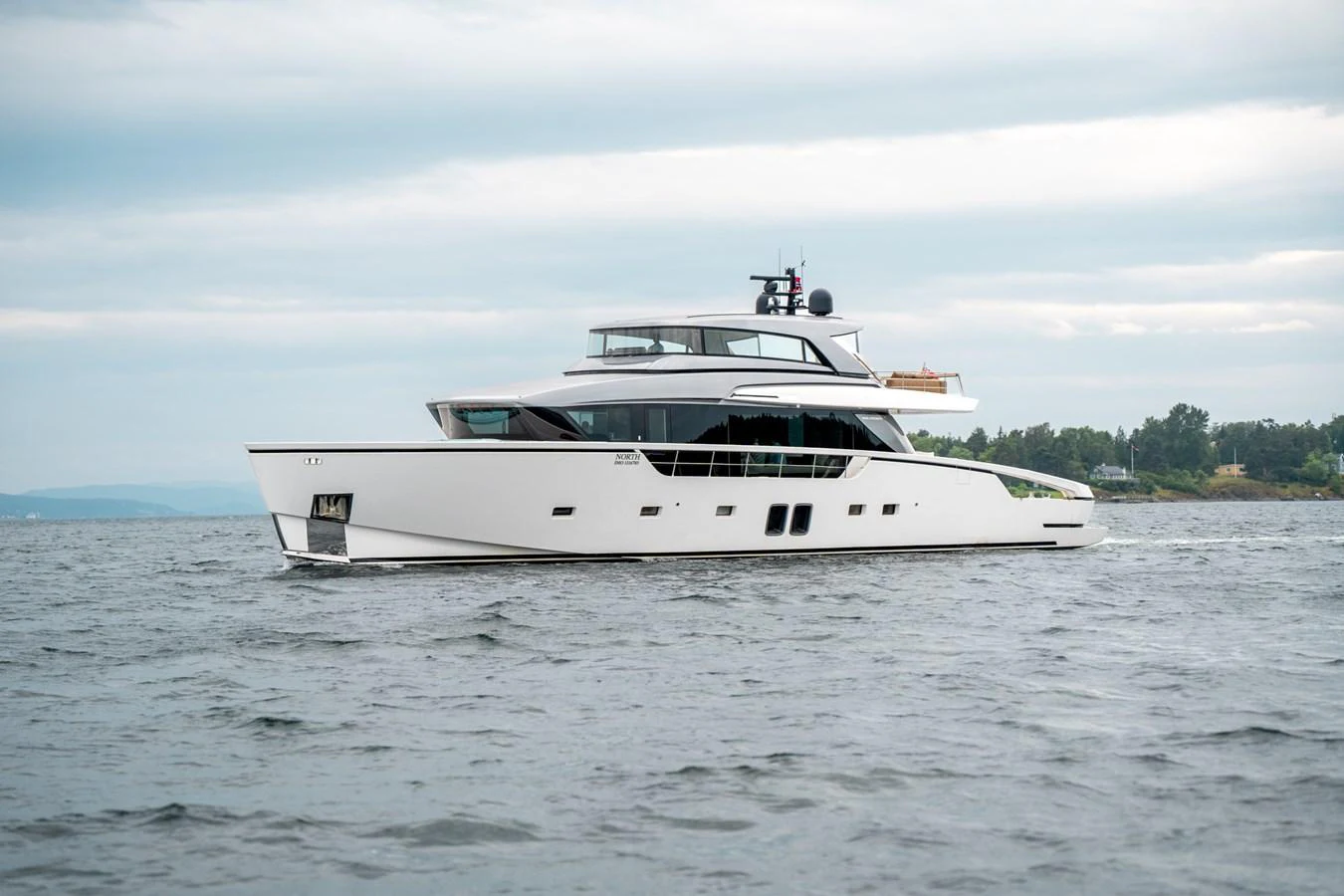 a white yacht on the water aboard NORTH Yacht for Sale